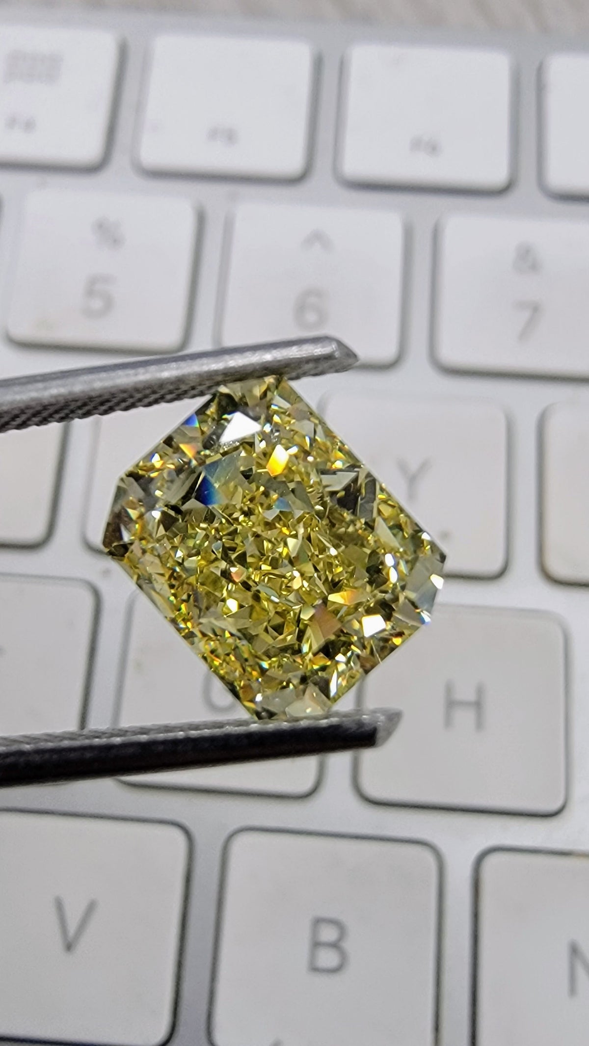 4.05ct Fancy Intense Yellow Elongated Radiant Diamond Ring VVS1 GIA — view 4 — Laura Milman New York