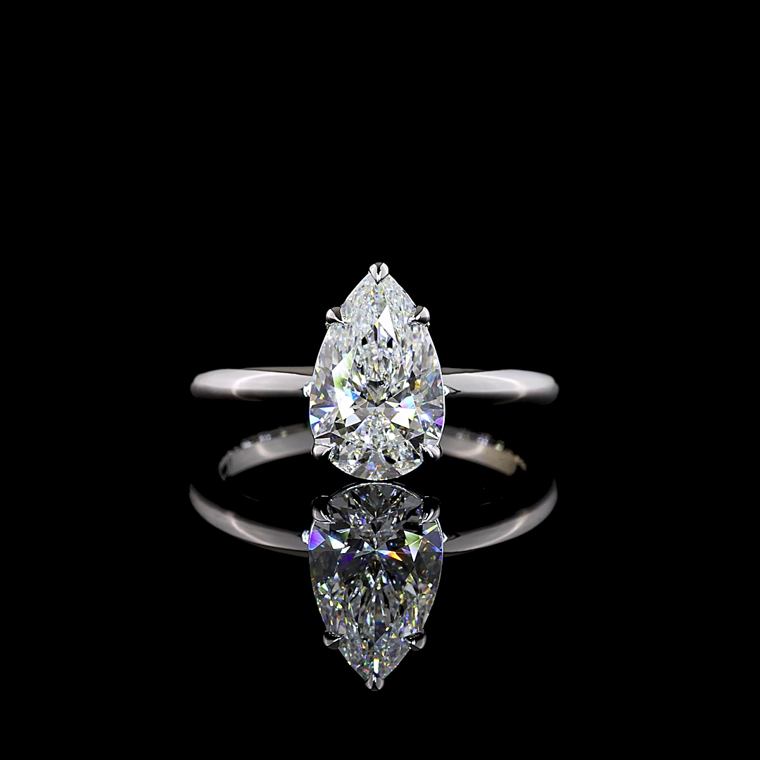 Pear Solitaire setting design reference in 14K white gold; pictured center diamond is not included — Laura Milman New York