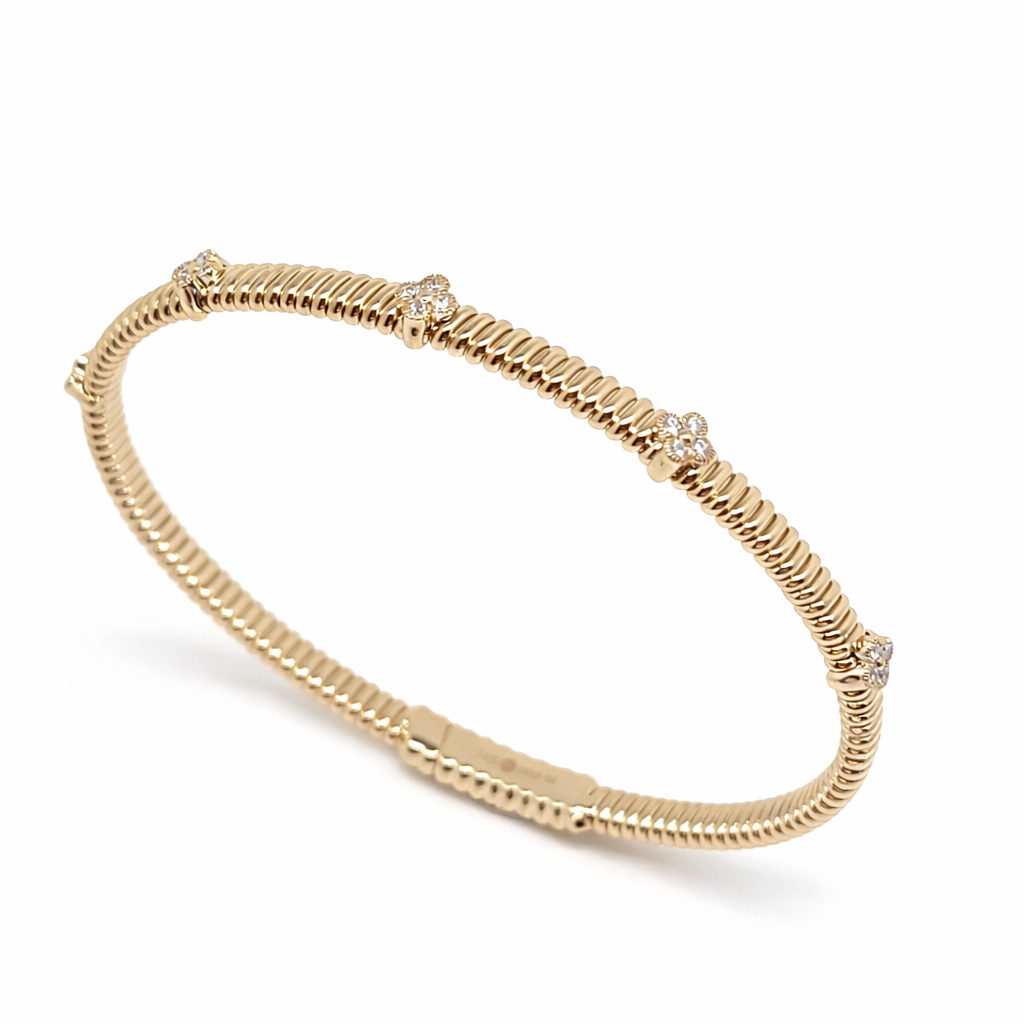 Elegant gold bangle with diamond accents - Laura Milman New York