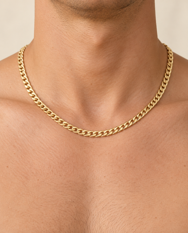 5.5mm Cuban Chain Necklace in 14K Yellow Gold — on-body view
