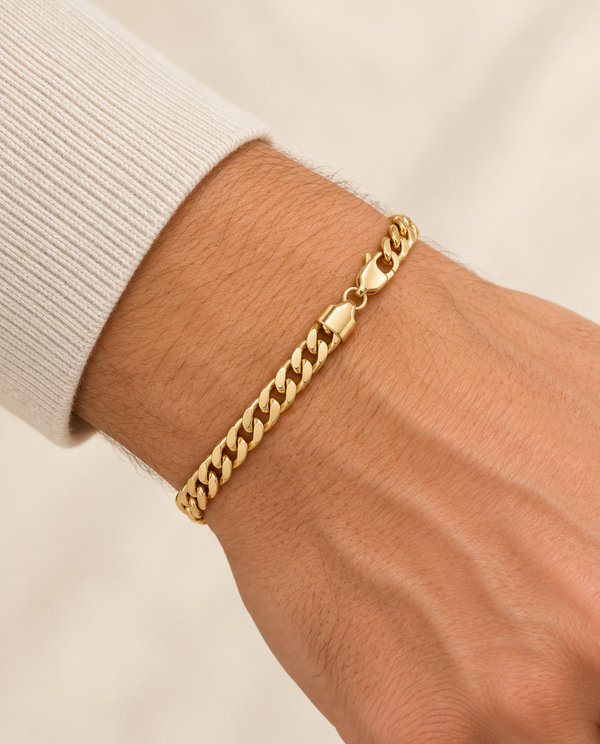 5.5mm Cuban Chain Bracelet in 14K Yellow Gold — on-wrist view