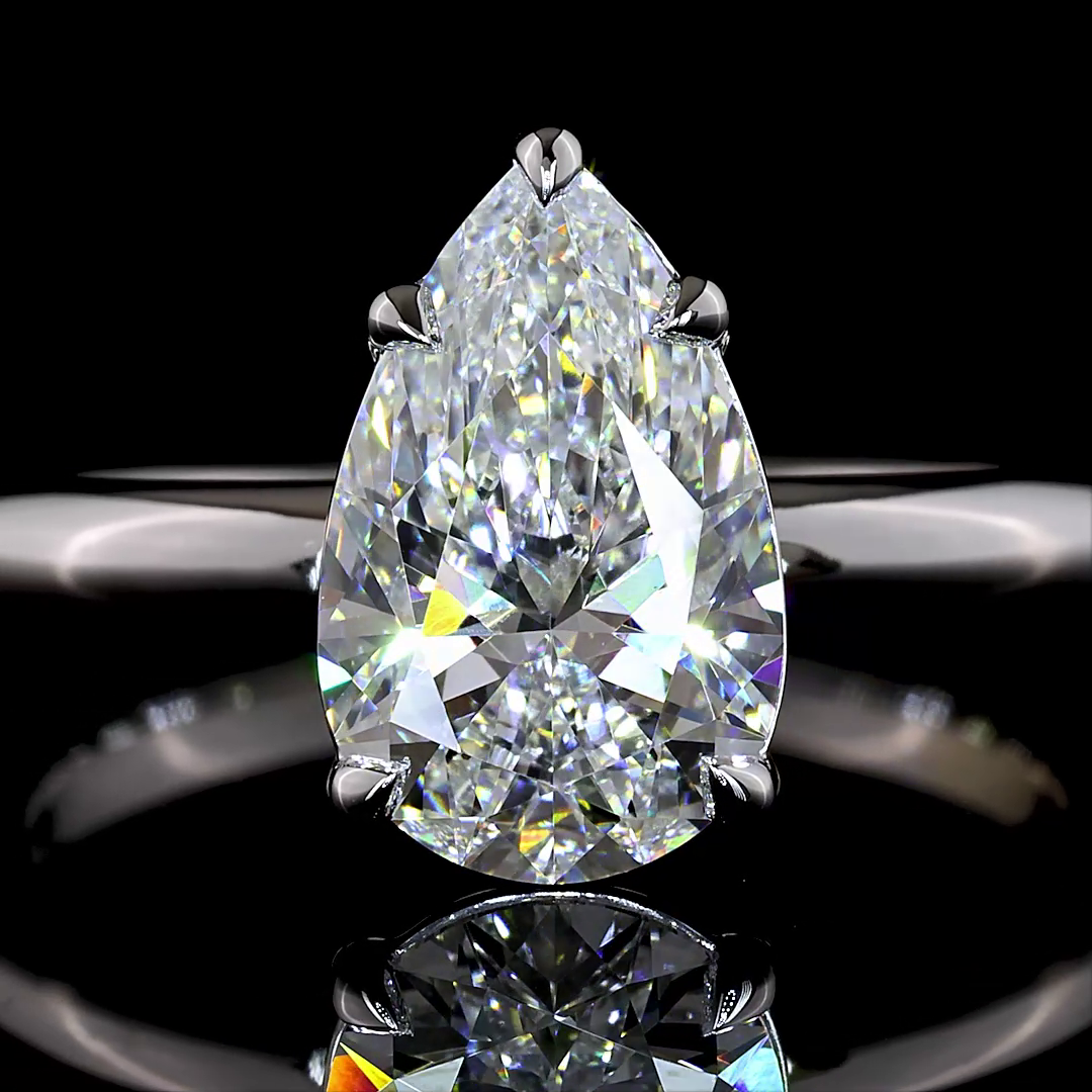 Pear Solitaire setting design reference in 14K white gold; pictured center diamond is not included — Laura Milman New York