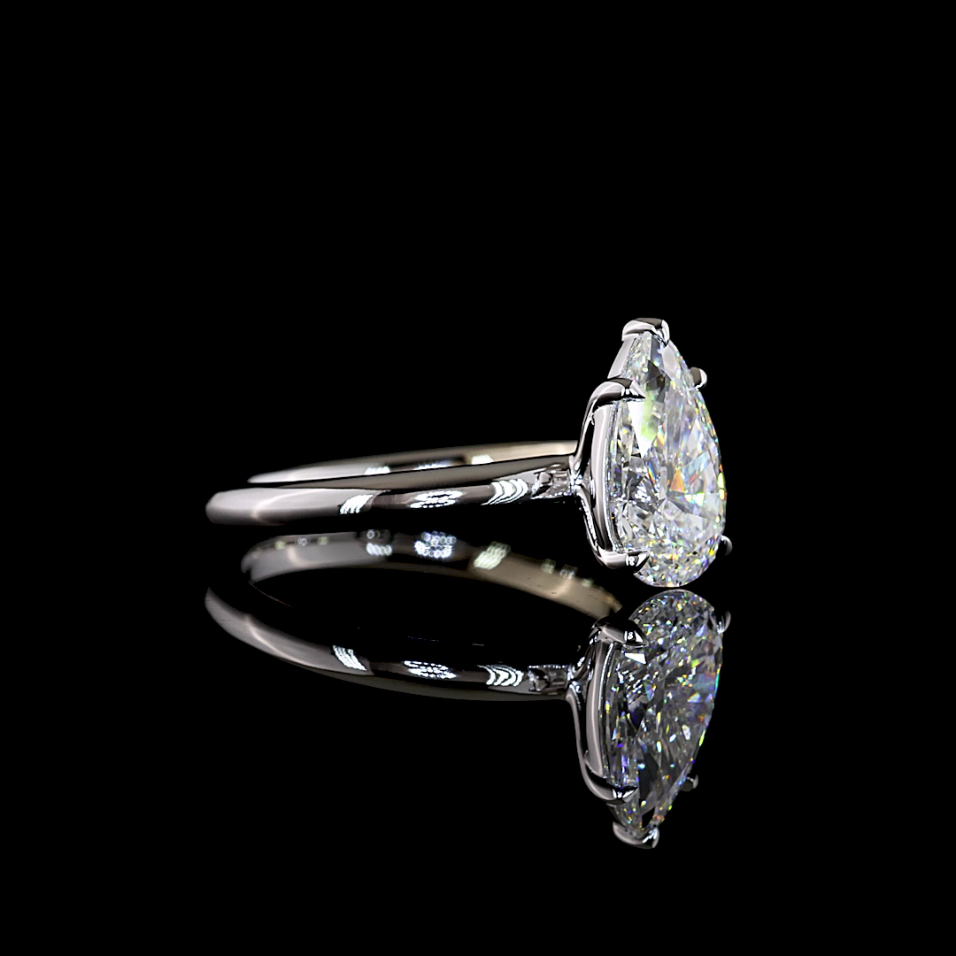 Pear Solitaire setting design reference in 14K white gold; pictured center diamond is not included — Laura Milman New York